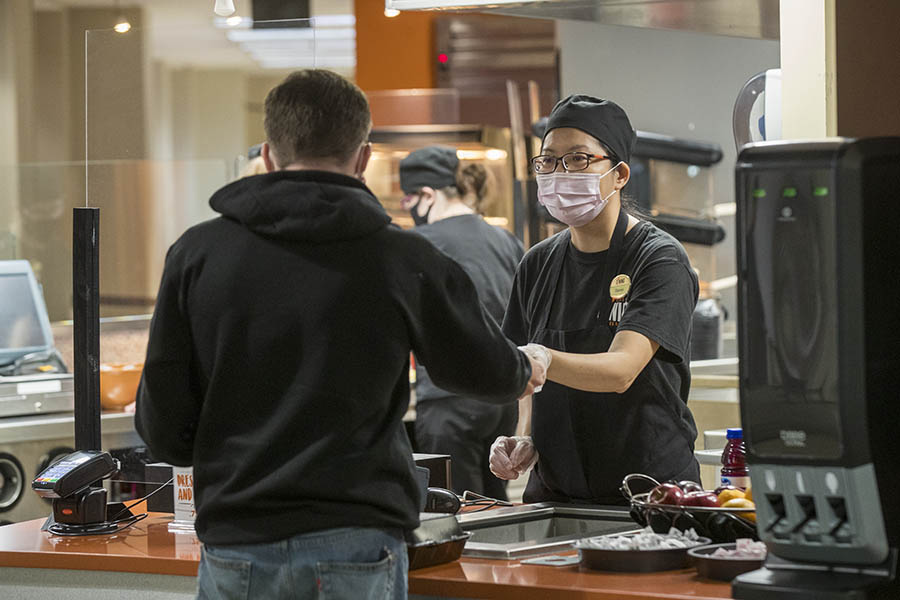University Dining Services employee helping a customer