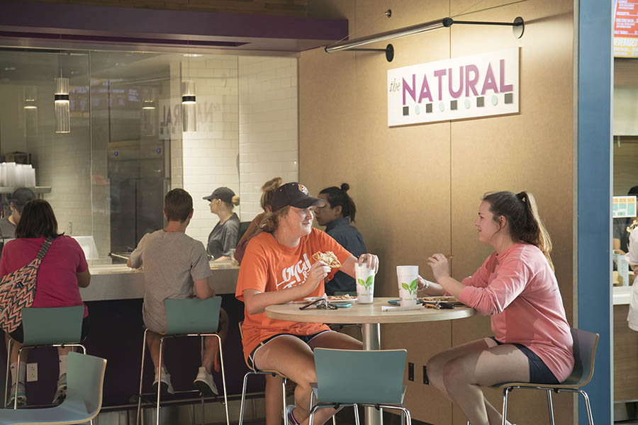 Students eating at The Natural